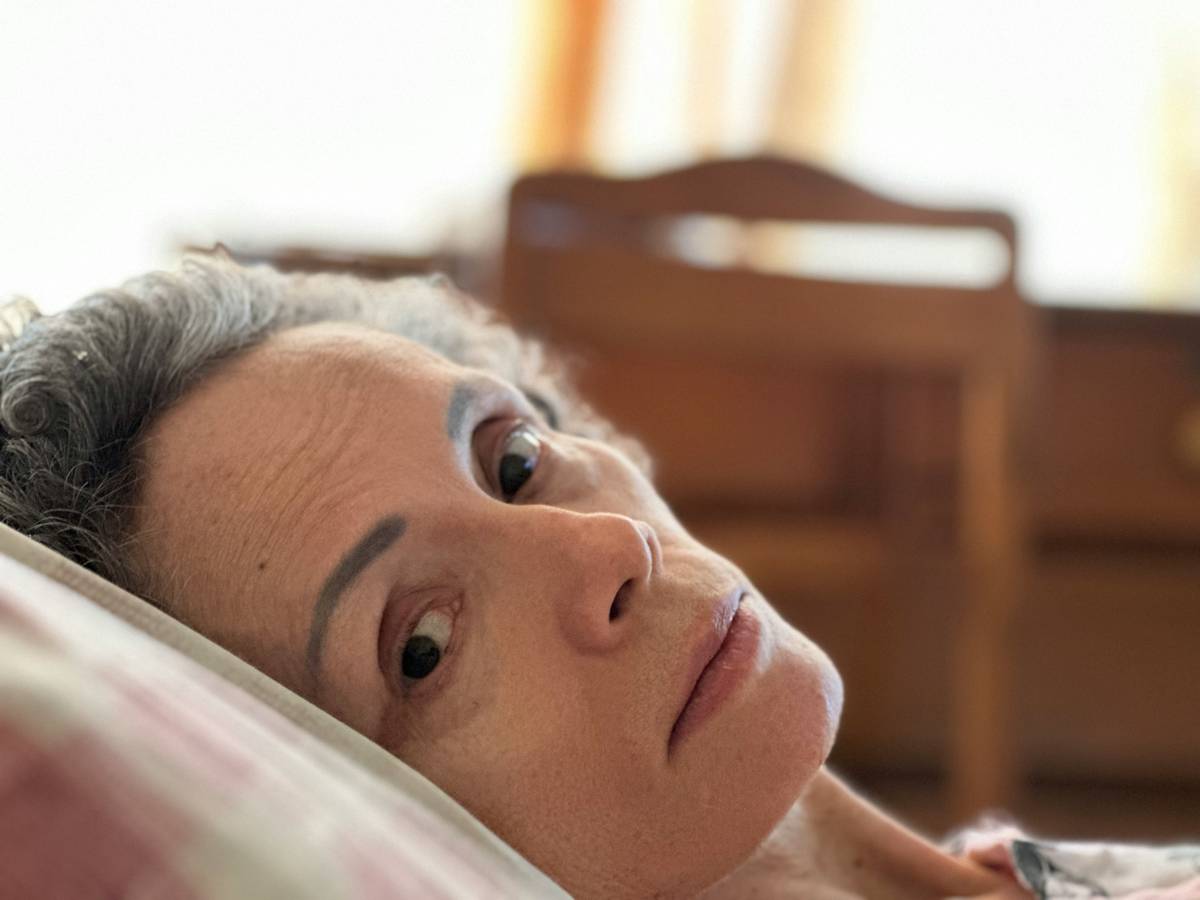 herbal supplements for menopausal women on a wooden table with dosage guide