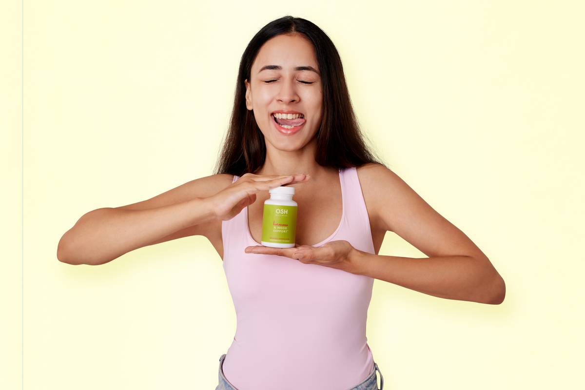 woman reviewing menopause supplements to take on kitchen counter