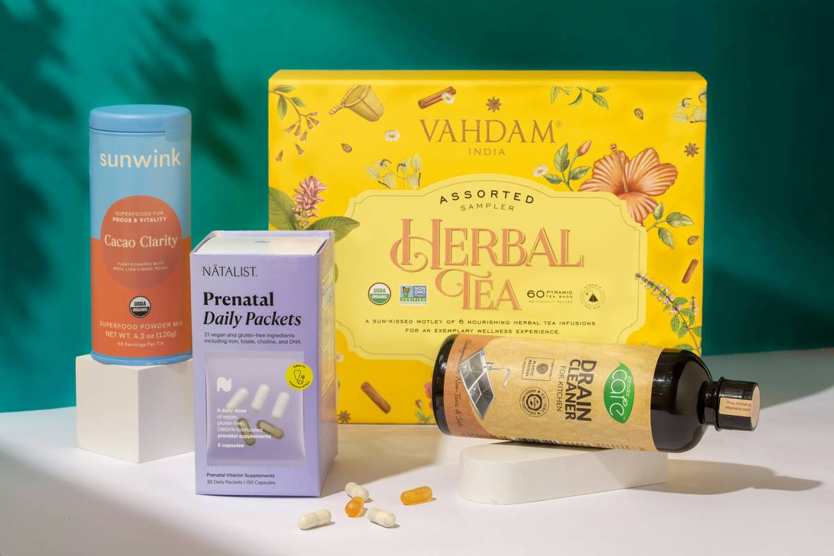 woman reviewing menopause relief herbal supplements on kitchen counter